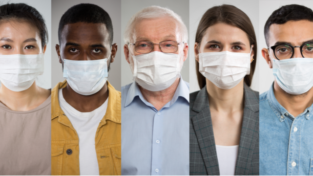five people wearing masks